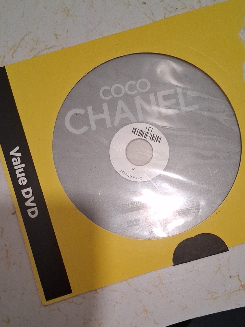 CHANEL Silver Disc in Yellow Sleeve